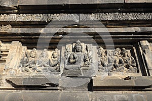 King Deity stone carving relief in Prambanan Temple