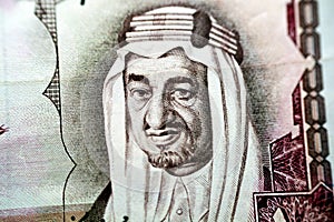 King Faisal Bin AbdulAziz, former king of Saudi Arabia from the obverse side of 10 ten Saudi riyals banknote currency photo