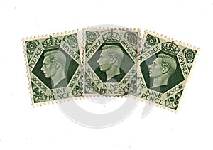 King George VI nine pence postage stamps from Great Britain.