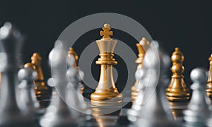 King golden chess standing confront of the silver chess team.chess board game concept of business ideas