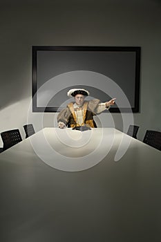 King Henry VIII pointing in conference room photo