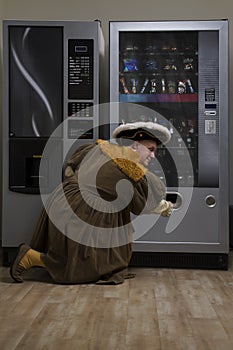 King Henry VIII using vending machine in cafe