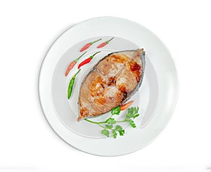 King mackerel or spotted mackerels steak with dish isolated on white background ,fried Scomberomorus fish ,include clipping path