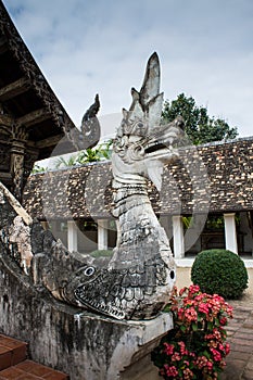 The King of Nagas at the door of a Buddhist temple.