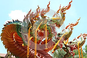 King of nagas or serpents, snake statues in Thai temples, sky background