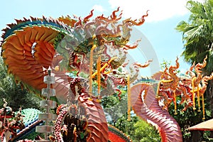 King of nagas or serpents, snake statues in Thai temples, sky background