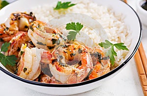 King prawn tails in orange-garlic sauce with parsley