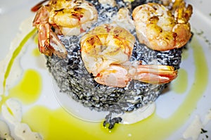 King prawns grilled with a side of black rice