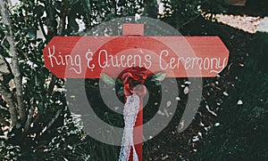 King and queens ceremony sign