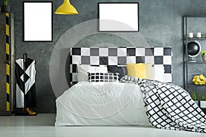 King-size bed with checkered bedhead photo