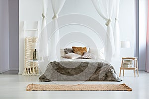 King-size bed with fur coverlet photo