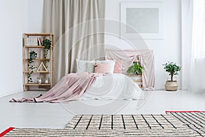 King-size bed in pastel bedroom