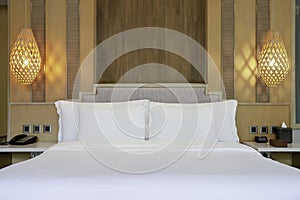 King size bed in room at a luxury hotel