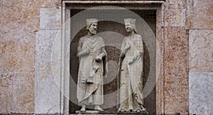 King Solomon and Queen Sheba, statues on a facade of the Baptistery in Parma, Italy