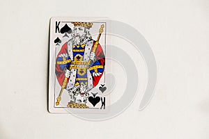 King of spades playing card, white background, copy space