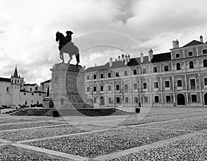 The king statue and Ducal Palace of Vila ViÃ§osa at the real palace yard in black and white