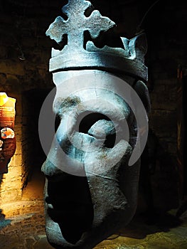 King - statue head-Caernarfon Castle is a medieval fortress in Caernarfon, Gwynedd, north-west Wales cared for by Cadw