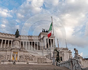 King Vittorio Emanuele monument partial view under an impressive cloudy sky.