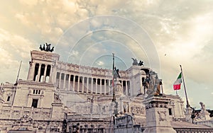 King Vittorio Emanuele monument's impressive facade under cloudy sky.