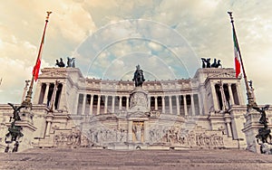 King Vittorio Emanuele monument's impressive facade under cloudy sky.