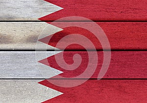 Kingdom of Bahrain flag on wooden surface