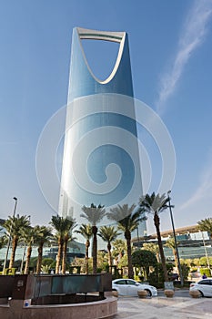 Kingdom Center tower or Burj Al Mamlaka glows a blue color  again blue sky