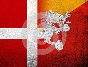 The Kingdom of Denmark National flag with Kingdom of Bhutan National flag. Grunge Background
