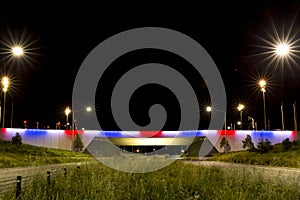 Kings Avenue Bridge in blue, white and red