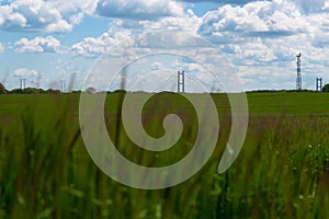 The Humber Bridge in the background with green fields in the fore ground slightly