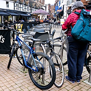 Woman Getting Ready To Leave On Her Bicycle On A Gray Winters Day