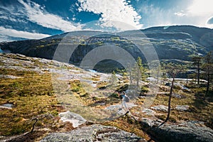 Kinsarvik, Hordaland, Norway. Young Woman Lady Tourist Traveler Backpacker Hiking In Hardangervidda Mountain Plateau