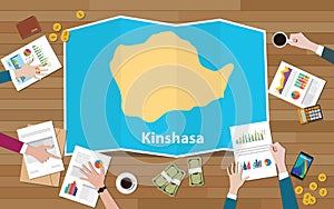 Kinshasa congo republic capital city region economy growth with team discuss on fold maps view from top