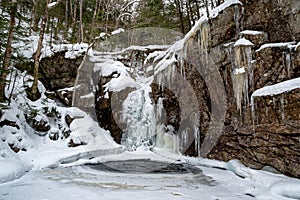 Kinsman Falls in Franconia Notch State Park during winter . New Hampshire mountains. USA photo