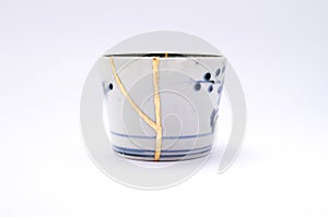 Kintsugi antique Japanese soba cup restored with gold.