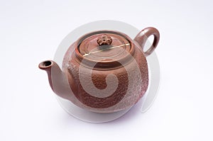 Small bizen teapot repaired with the antique kintsugi real gold technique photo