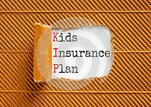 KIP kids insurance plan symbol. Concept words KIP kids insurance plan on beautiful white paper. Beautiful brown paper background. photo