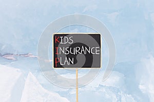 KIP kids insurance plan symbol. Concept words KIP kids insurance plan on beautiful yellow blackboard. Beautiful blue ice photo