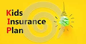 KIP kids insurance plan symbol. Concept words KIP kids insurance plan on beautiful yellow paper. Beautiful yellow background. photo