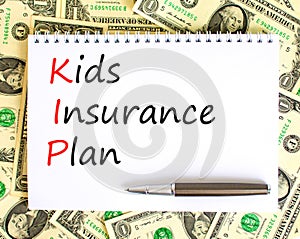 KIP kids insurance plan symbol. Concept words KIP kids insurance plan on beautiful white note. Dollar bills. Beautiful dollar photo