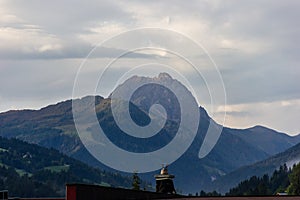Kirchberg in Tirol, Tirol/Austria - September 19 2018: far sight from the hotel garden with a chimney in the foreground and the