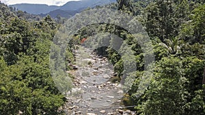 Kiriwong Village. Aerial view of the stream with trees along.