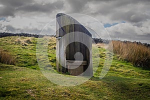 Wooden seat on  The coast to coast path leading from the summit of Nine Standards Rigg to Kirkby stephen photo