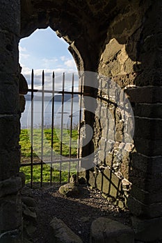Gate with view to ocean in Magnus Cathedral, KirkjubÃÂ¸ur, Faroe Islands, Denmark photo