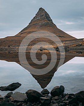Kirkjufell Mountain near the Snaefellsjokull National Park, Iceland reflected in the lake