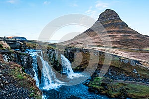 Kirkjufell mountain in the village of Grundarfjorur in western Iceland and its Kirkjufellfoss waterfall