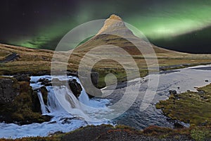 Kirkjufell popular mountain in Iceland with aurora lights