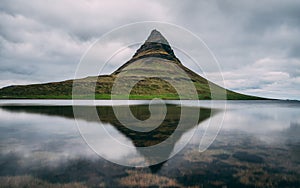 Kirkjufell at snaefellsnes. beautiful water reflection of kirkjufell with really smooth water picturesque iceland