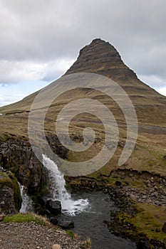 Kirkjufellfloss waterfall with Mt. Kirkjufell in background photo