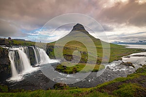 Kirkjufellfoss and Kirkjufell mountain in cloudy day ,Iceland.