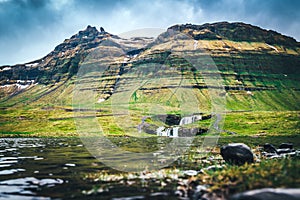 Kirkjufellfoss with mountain behind it